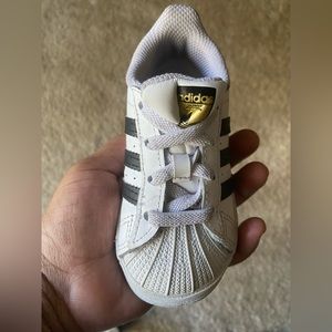Adidas toddler sneaker. Typically fits 1 - 4 year olds.